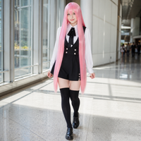 Model wearing a pink 40 inch long straight cosplay wig at a convention