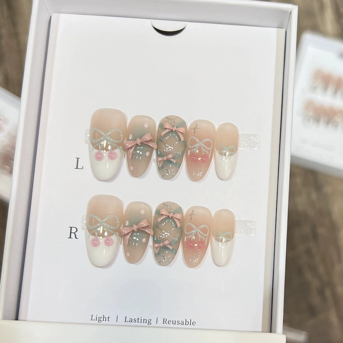 10pcs Handmade Cat Eye Almond Press-On Nails – Light Blue with Bow Accent