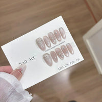 10pcs Handmade Cat Eye Almond Press-On Nails – Light Blue with Bow Accent