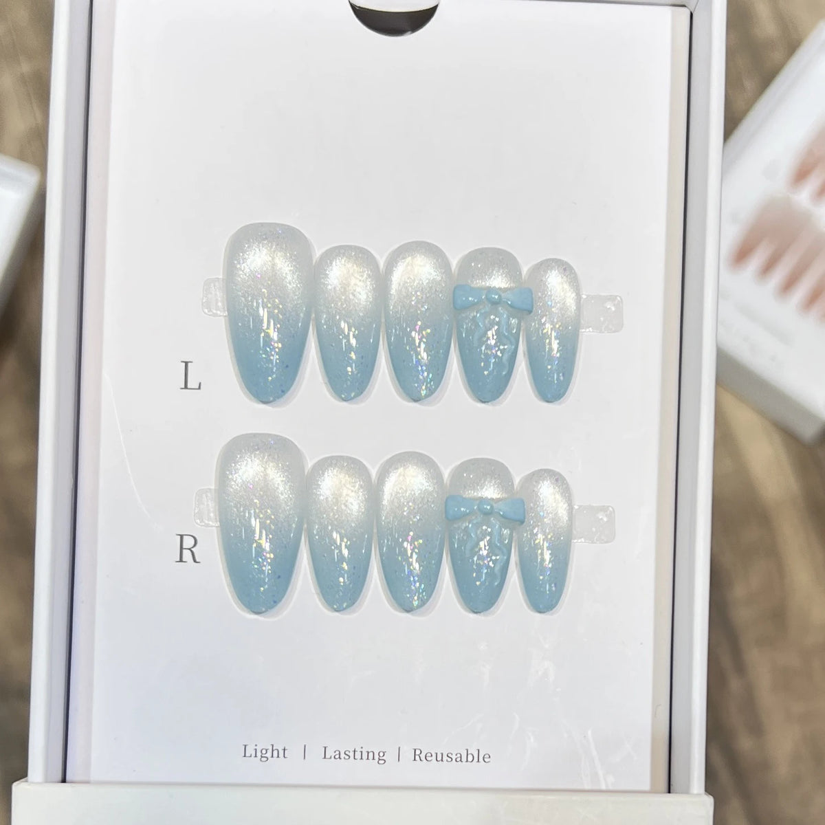 10pcs Handmade Cat Eye Almond Press-On Nails – Light Blue with Bow Accent