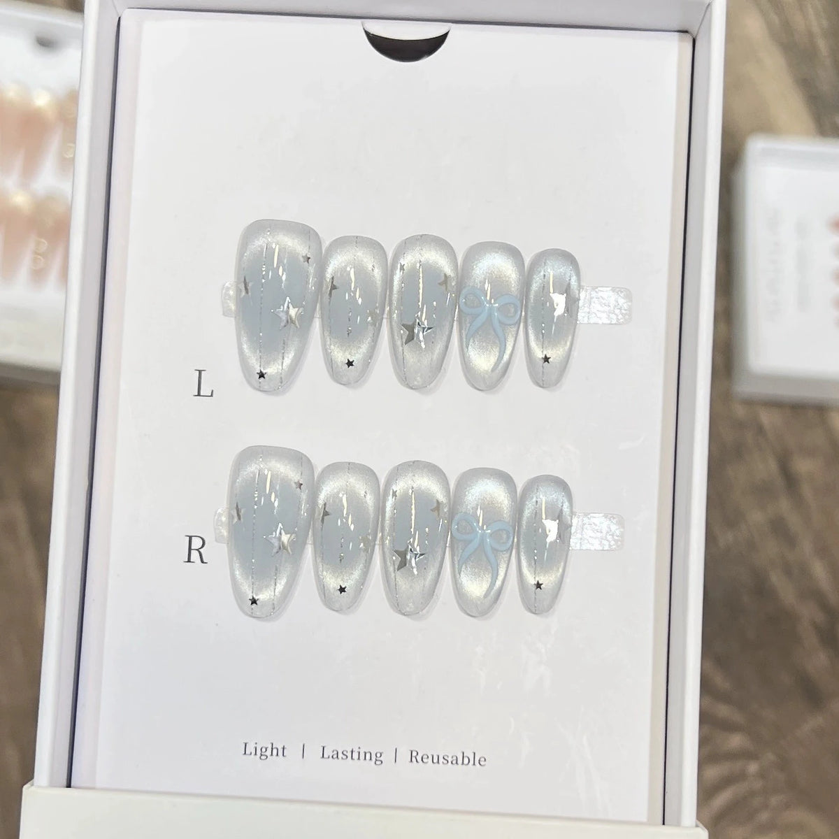 10pcs Handmade Cat Eye Almond Press-On Nails – Light Blue with Bow Accent