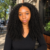 Model wearing Afro Kinky Curly Human Hair for Crochet Braids – Pre-Separated in outdoor lifestyle view