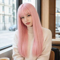 Model wearing pastel pink 26 inch straight wig with bangs at cafe