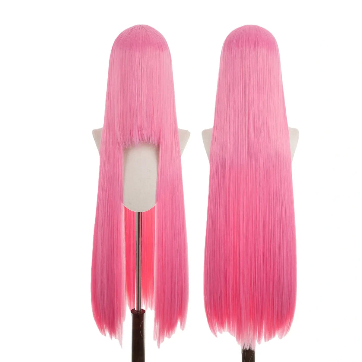 Two pink wigs on mannequin heads against a white background