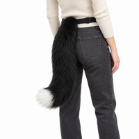 Black and white tail worn by model on white background
